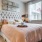 a bedroom with a bed and lamps
