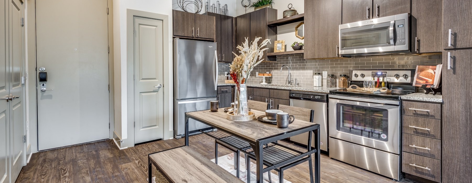 a kitchen with a table and chairs