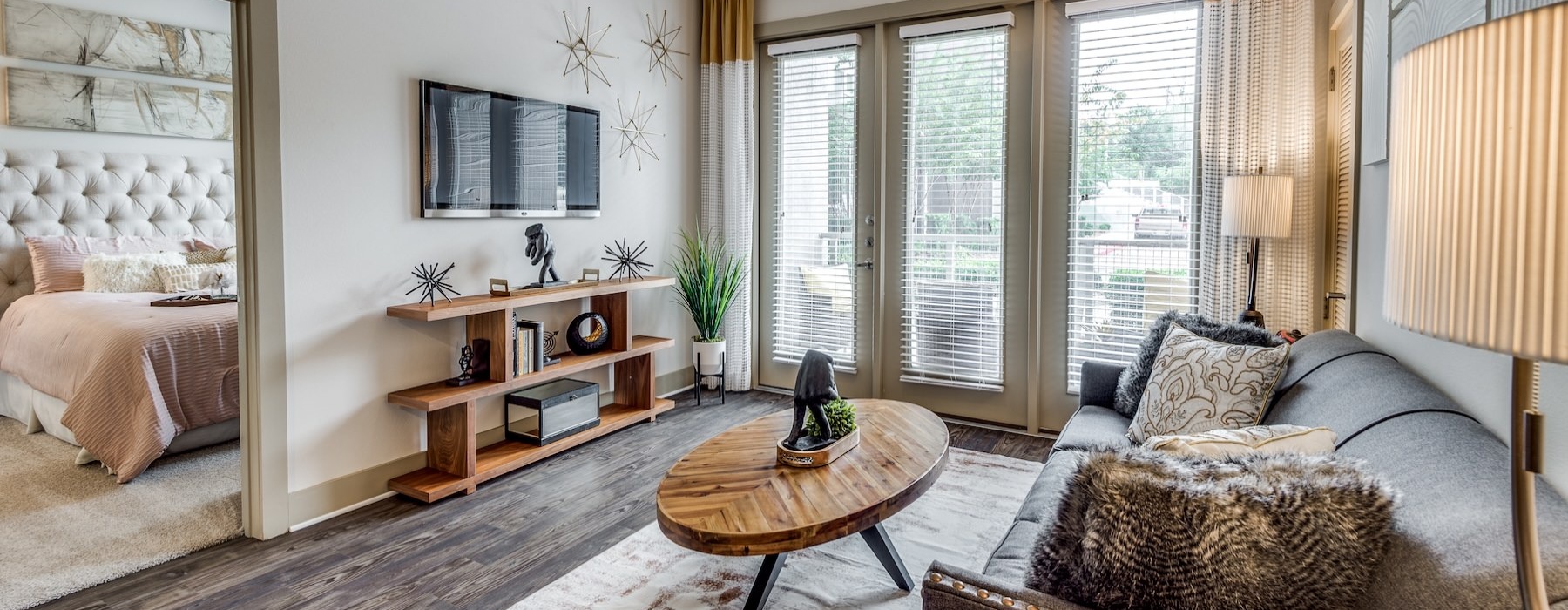a living room with a bed and a couch