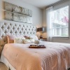 a bedroom with a bed and two nightstands