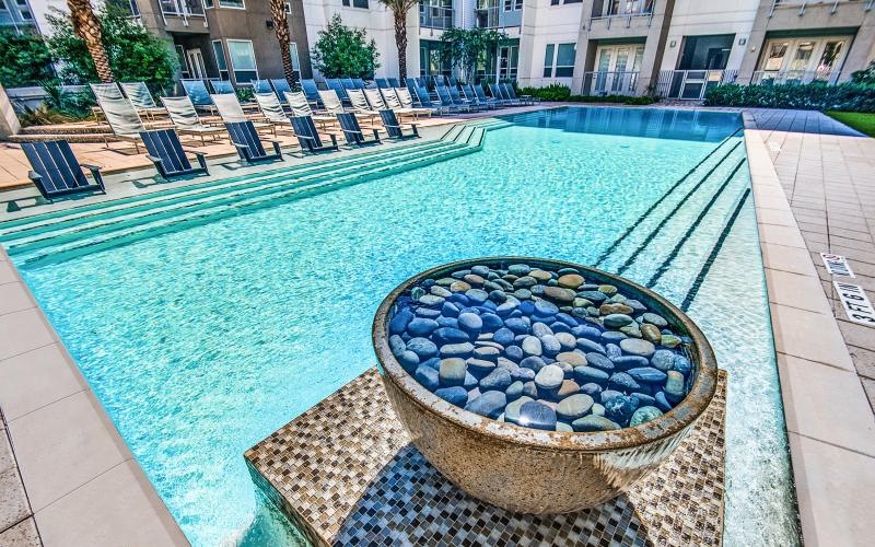 a pool with chairs around it