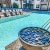 a pool with chairs around it