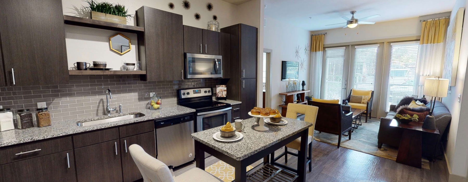 kitchen with brown cabinets couch and coffee table