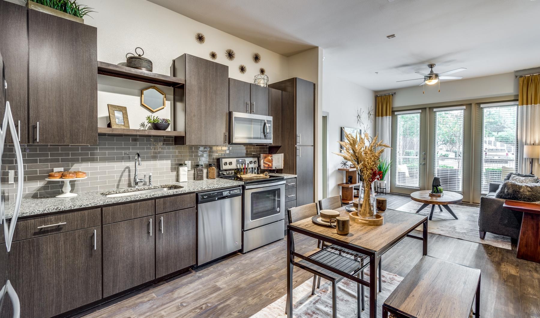 a kitchen with wooden cabinets