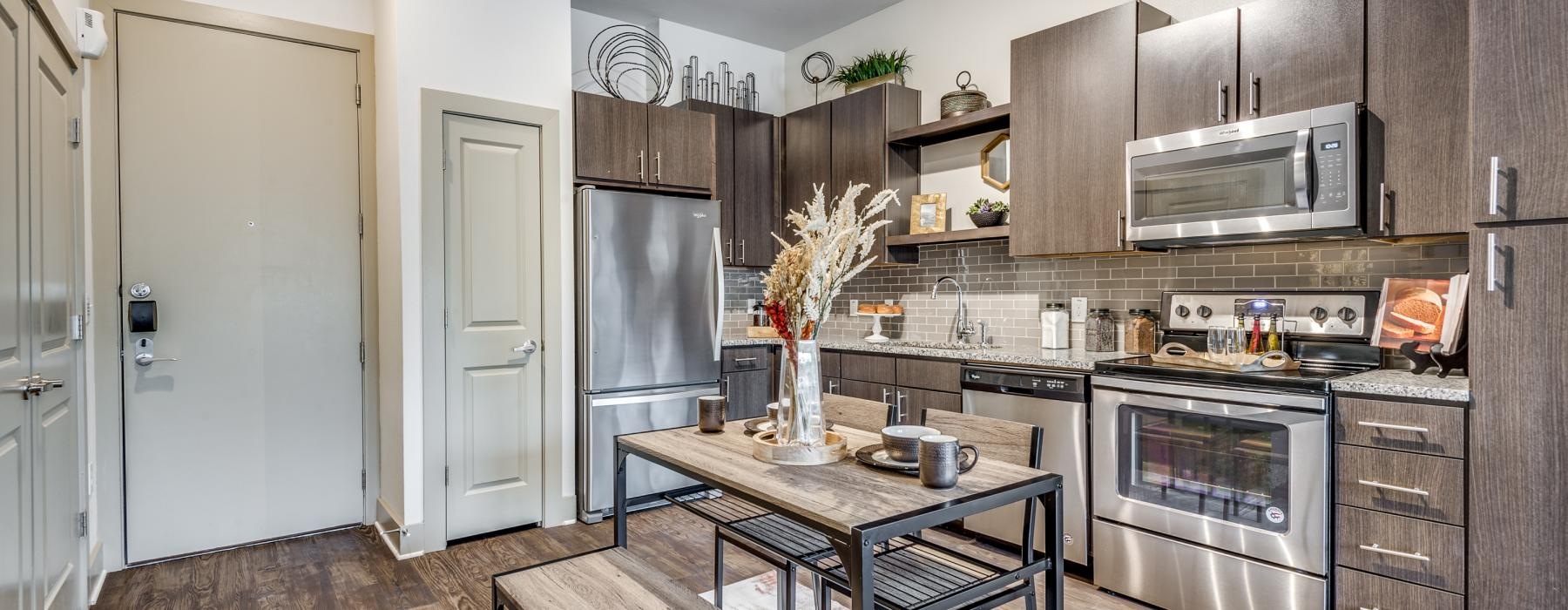 a kitchen with a table and chairs
