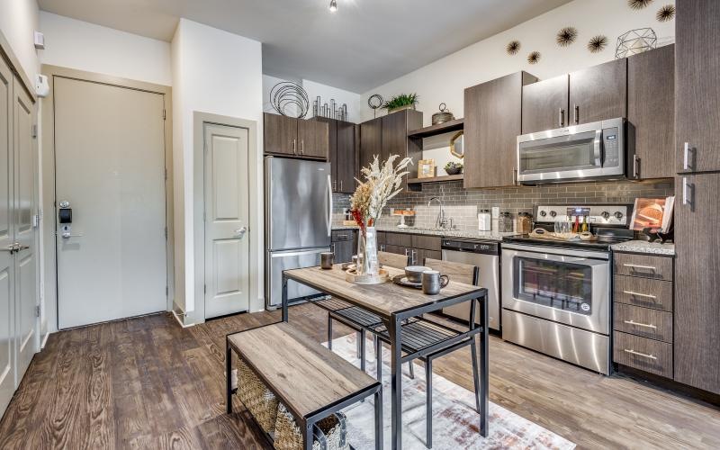 a kitchen with a table and chairs